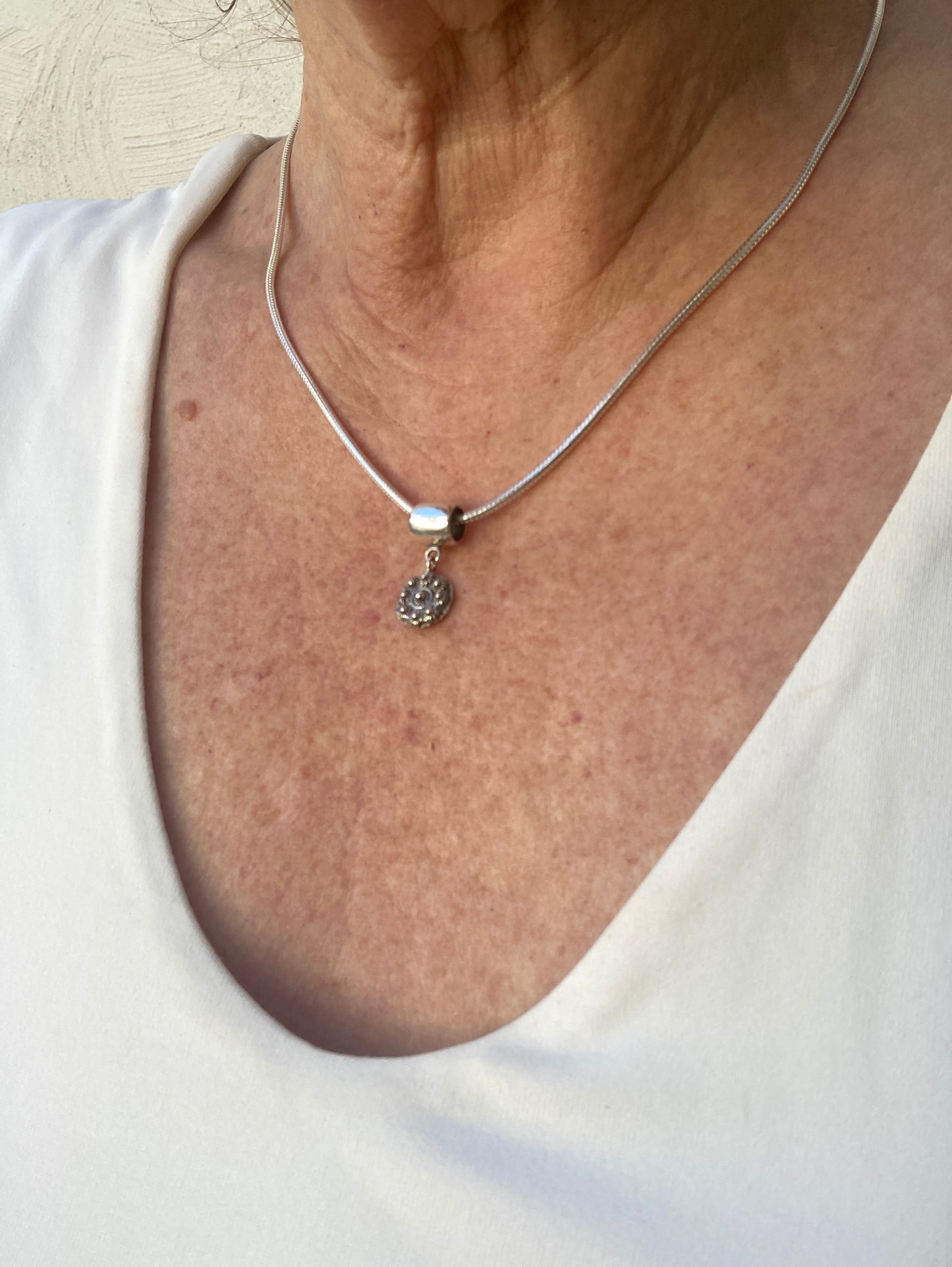 Pandora pendant with Goes button, traditional jewelry from the Netherlands