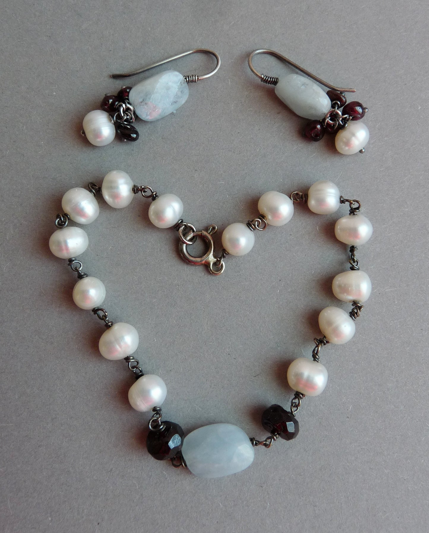 bruidssieraden set aquamarijn granaat parel