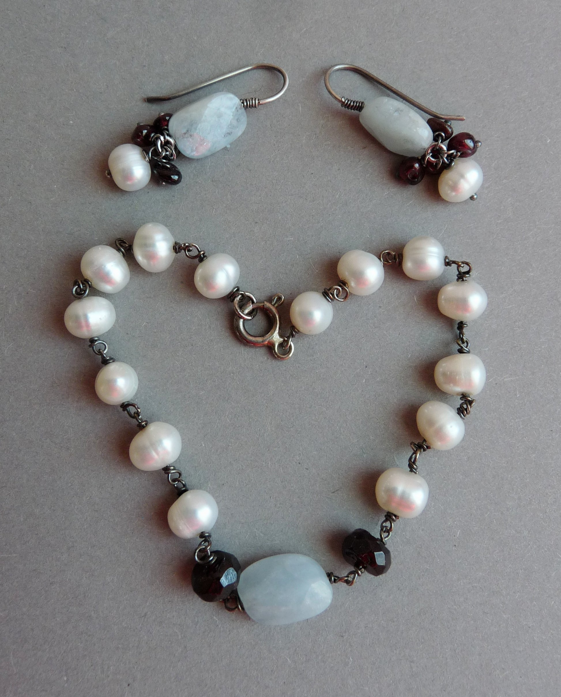 bruidssieraden set aquamarijn granaat parel