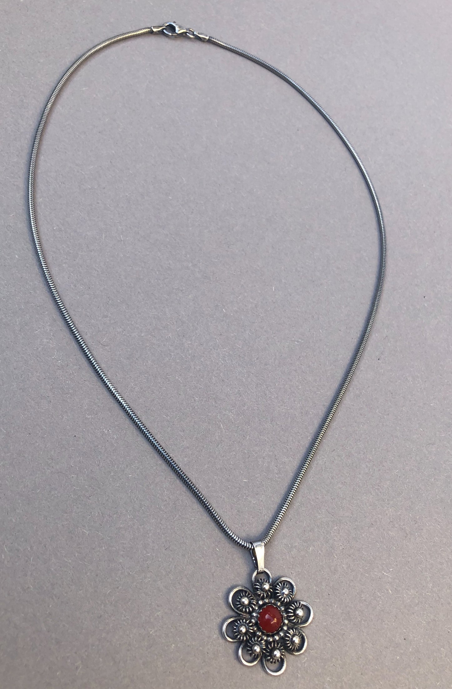 Zeeland Knot Pendant with Carnelian • Handmade Silver Jewelry with Meaning