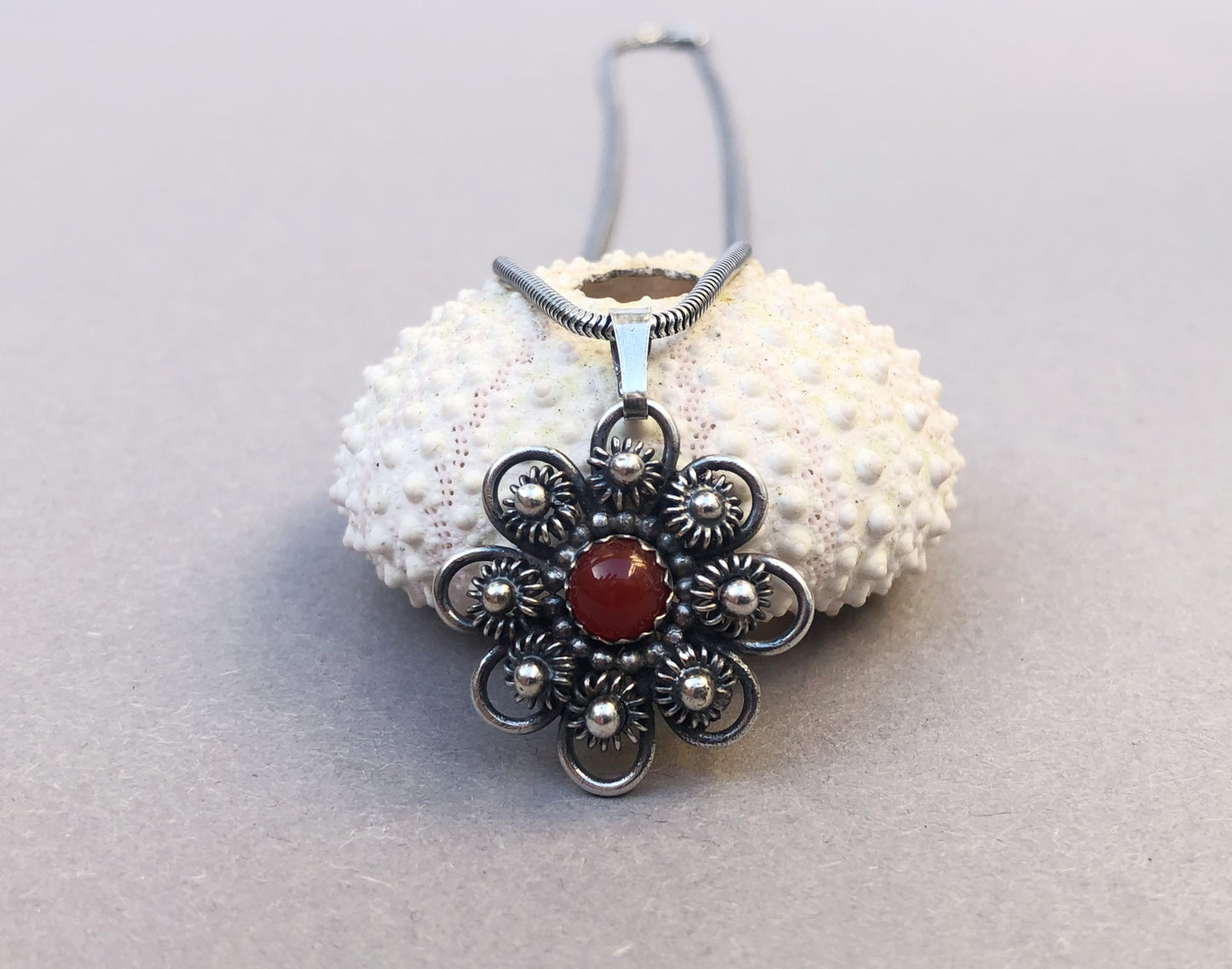 Zeeland Knot Pendant with Carnelian • Handmade Silver Jewelry with Meaning