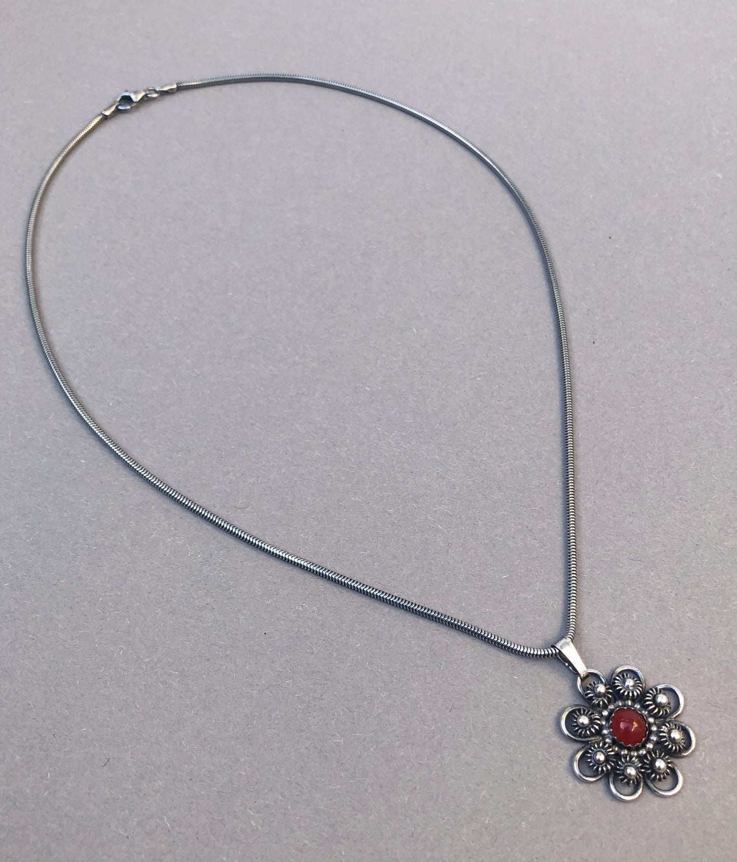 Zeeland Knot Pendant with Carnelian • Handmade Silver Jewelry with Meaning