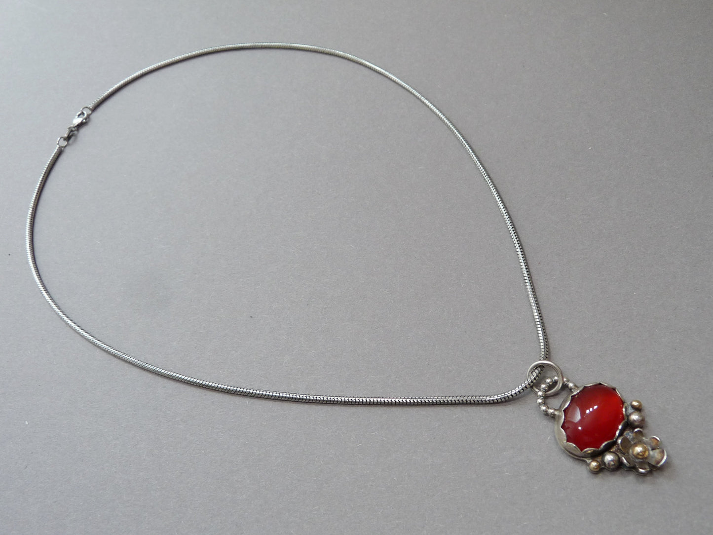 Gold and silver pendant necklace with Carnelian