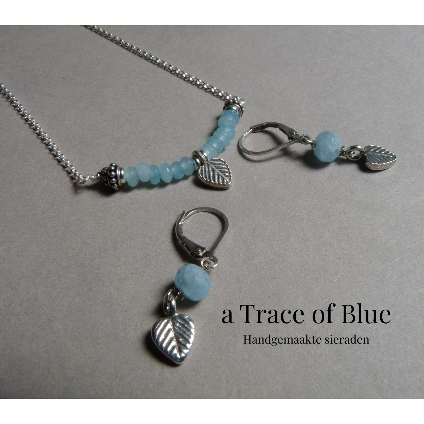 Zilveren oorbellen met Aquamarijn en blaadjes