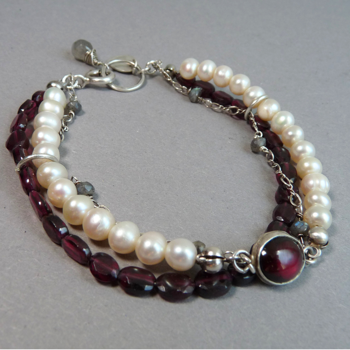 Maatwerk ringenset Vuur en Parel – eindbetaling en bijpassende armband