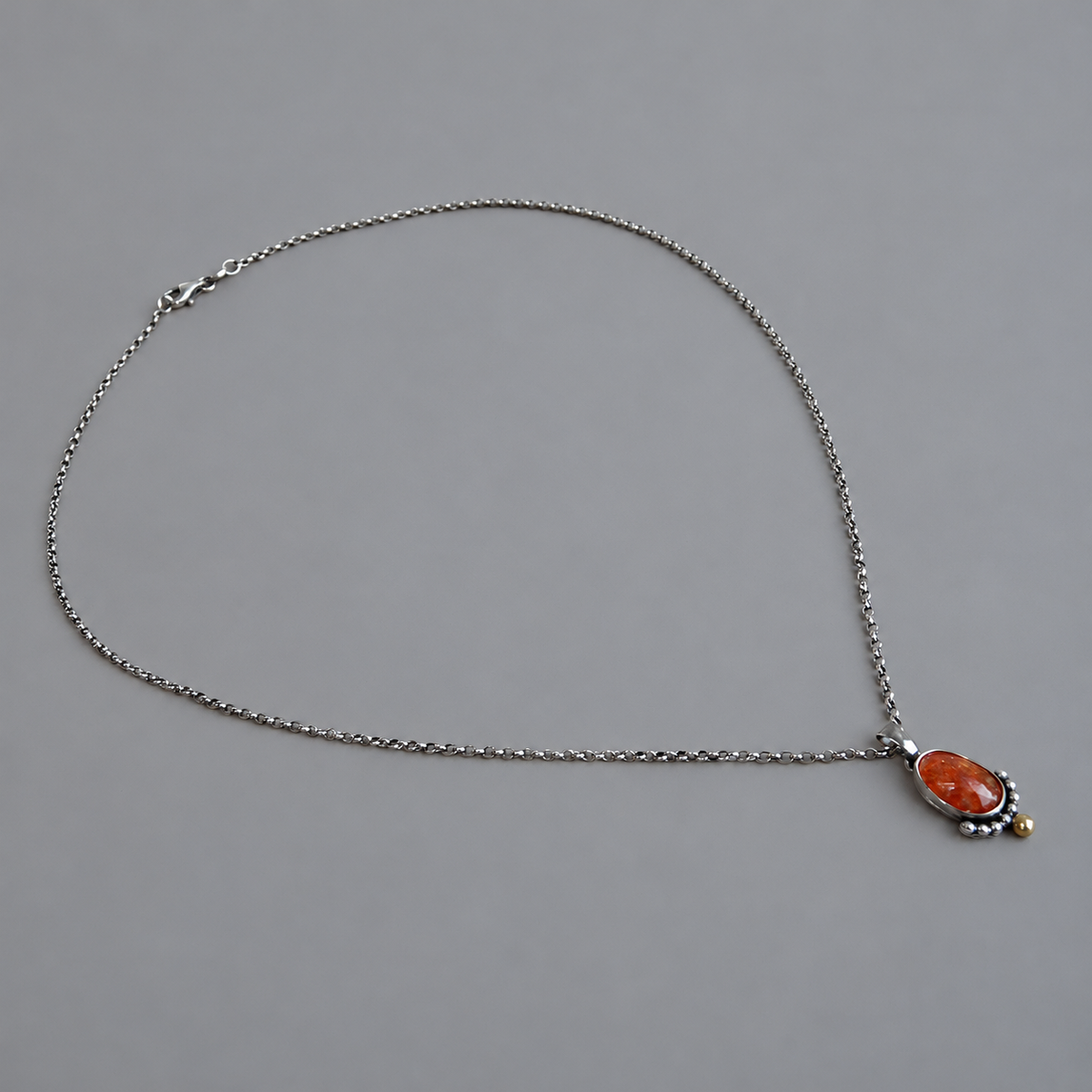 Complete geoxideerde sterling zilveren rolo ketting met de bicolor zonnesteen hanger