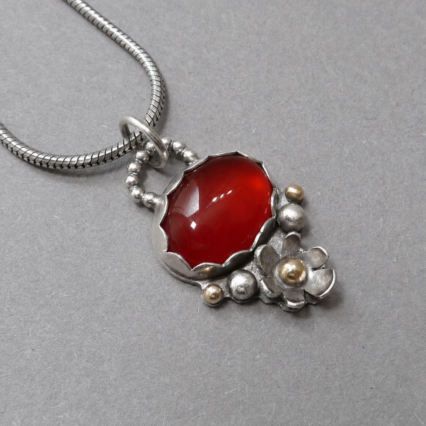 Gold and silver pendant necklace with Carnelian
