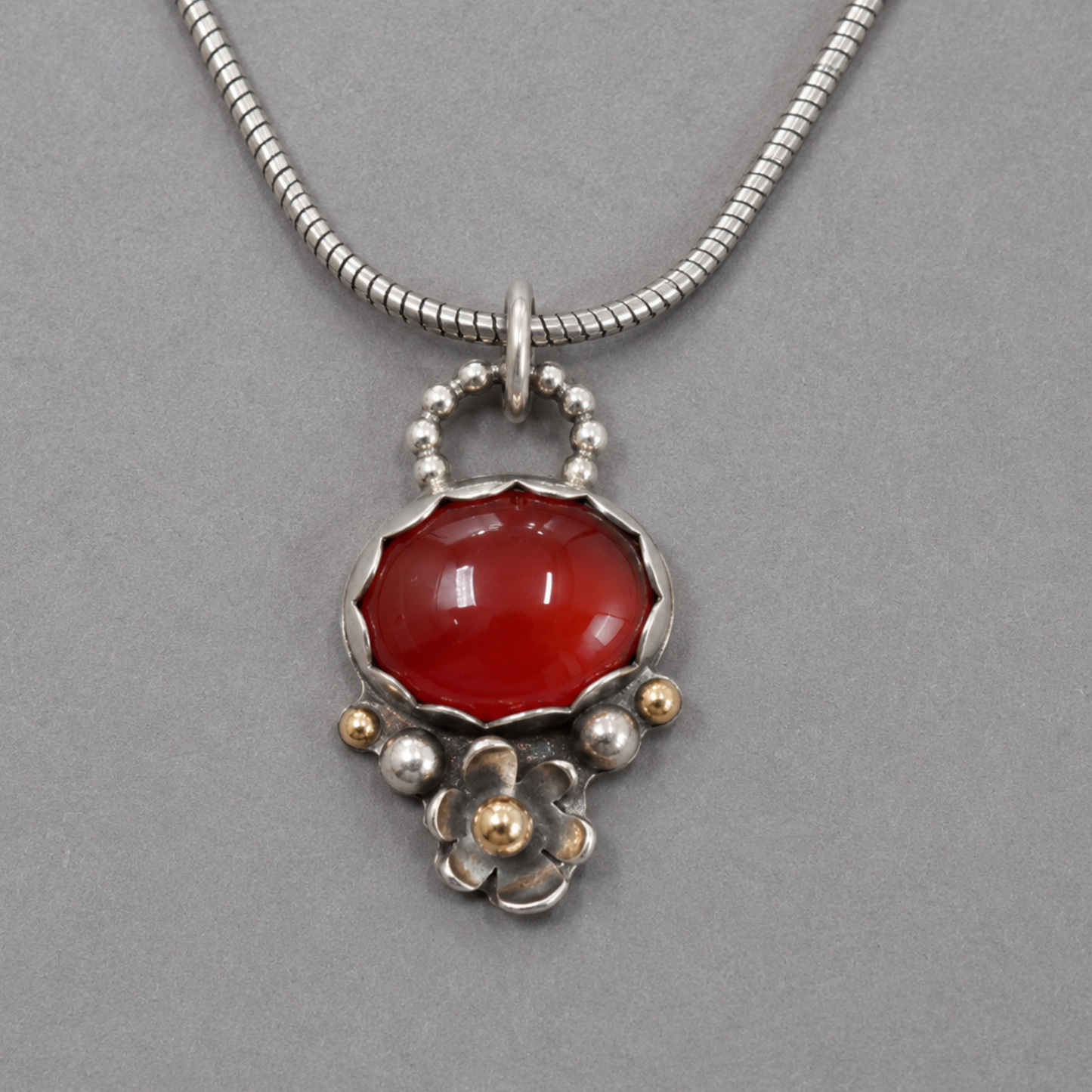 Gold and silver pendant necklace with Carnelian