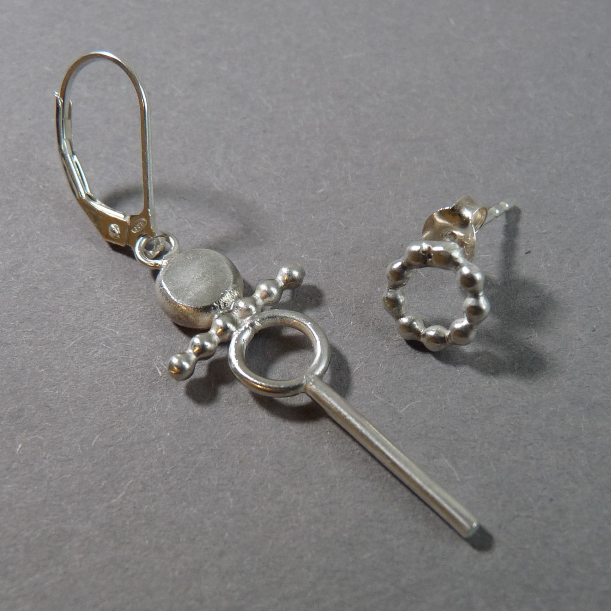 zilveren-oorbellenset-mannen-asymetris