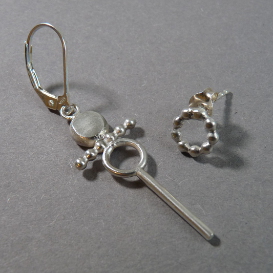 zilveren-oorbellenset-mannen-asymetris